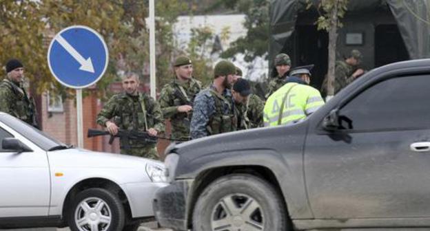 Law enforcers. Photo: REUTERS/Alkhan Gargayev Law enforcers. Photo: REUTERS/Alkhan Gargayev