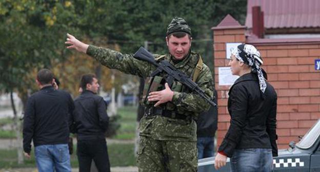Law enforcer. Photo: REUTERS/Alkhan Gargayev Law enforcer. Photo: REUTERS/Alkhan Gargayev
