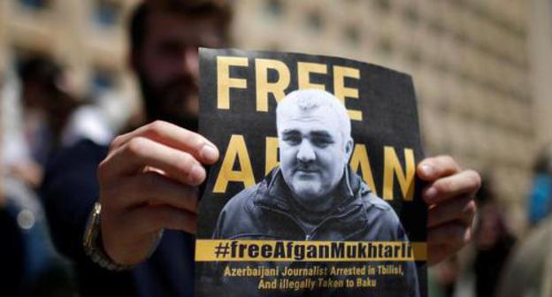 A poster at the protest action in support of Afghan Mukhtarly held in Tbilisi. Photo REUTERS/David Mdzinarishvili A poster at the protest action in support of Afghan Mukhtarly held in Tbilisi. Photo REUTERS/David Mdzinarishvili