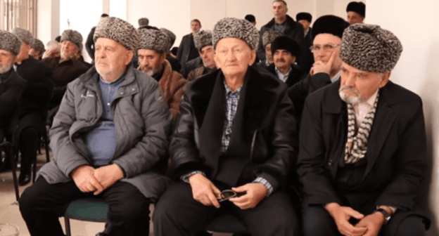 Members of the Council of Teips of the Ingush People listening to the "Appeal to the leadership and people of the Chechen Republic". Screenshot from the video appeal dated December 7 2018. https://youtu.be/waLyRPxTXQM Members of the Council of Teips of the Ingush People listening to the "Appeal to the leadership and people of the Chechen Republic". Screenshot from the video appeal dated December 7 2018. https://youtu.be/waLyRPxTXQM
