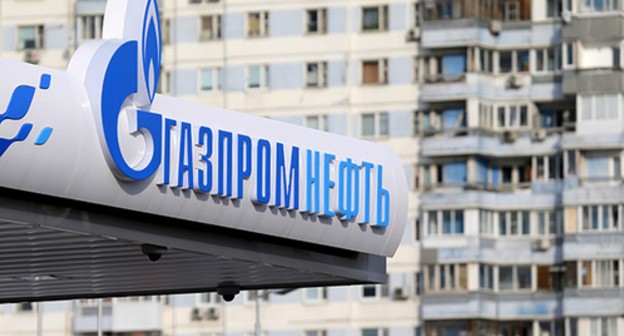 Logo of the Gazprom near a residential building. Photo: REUTERS/Maxim Shemetov Logo of the Gazprom near a residential building. Photo: REUTERS/Maxim Shemetov