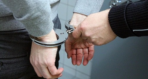 A man in handcuffs. Photo https://pixabay.com A man in handcuffs. Photo https://pixabay.com