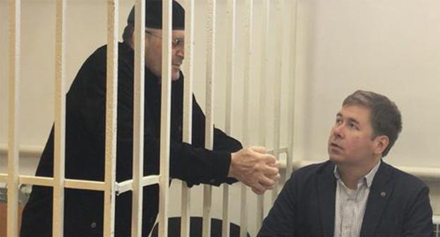 Oyub Titiev (on the left) and Ilya Novikov, an advocate, in the court room. Screenshot of the video by the "Caucasian Knot" Oyub Titiev (on the left) and Ilya Novikov, an advocate, in the court room. Screenshot of the video by the "Caucasian Knot"