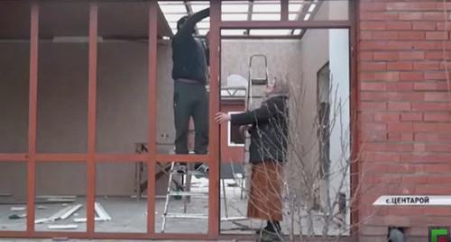 Residents of Tsentaroi at their house. Screenshot from video posted by 'Grozny' TV Company, https://www.youtube.com/watch?time_continue=26&v=QOYKFqW2ZFI Residents of Tsentaroi at their house. Screenshot from video posted by 'Grozny' TV Company, https://www.youtube.com/watch?time_continue=26&v=QOYKFqW2ZFI
