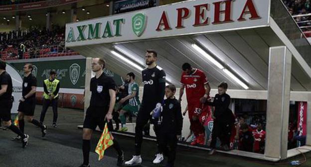Football players enter the field at the "Akhmat Arena" Stadium on April 13, 2019. Photo by the press service of the "Lokomotiv" FC ttps://www.fclm.ru/ru/publications/news/19888 Football players enter the field at the "Akhmat Arena" Stadium on April 13, 2019. Photo by the press service of the "Lokomotiv" FC ttps://www.fclm.ru/ru/publications/news/19888