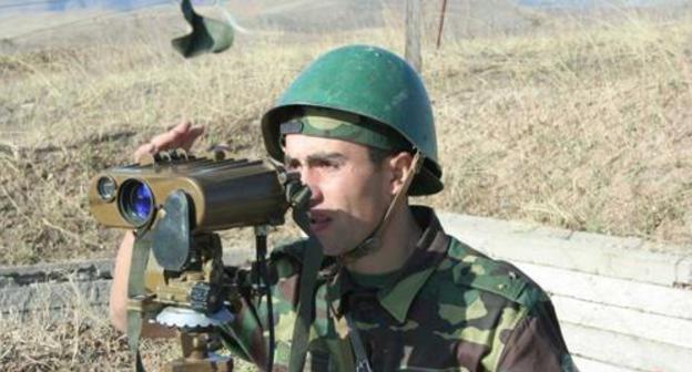 A soldier of the army of Nagorno-Karabakh at the military positions. Photo by the Ministry of Defence for Nagorno-Karabakh http://www.nkrmil.am A soldier of the army of Nagorno-Karabakh at the military positions. Photo by the Ministry of Defence for Nagorno-Karabakh http://www.nkrmil.am