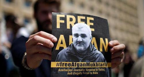 A poster with the photo of Afghan Mukhtarly. Photo: REUTERS/David Mdzinarishvili A poster with the photo of Afghan Mukhtarly. Photo: REUTERS/David Mdzinarishvili