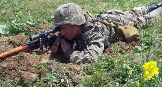 Serviceman at firing position. Photo: press service of the Ministry of Defence of Armenia, http://www.mil.am/ru/news/6276 Serviceman at firing position. Photo: press service of the Ministry of Defence of Armenia, http://www.mil.am/ru/news/6276