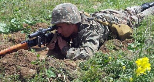 Serviceman at firing position. Photo: press service of the Ministry of Defence of Armenia, http://www.mil.am/ru/news/6276 Serviceman at firing position. Photo: press service of the Ministry of Defence of Armenia, http://www.mil.am/ru/news/6276