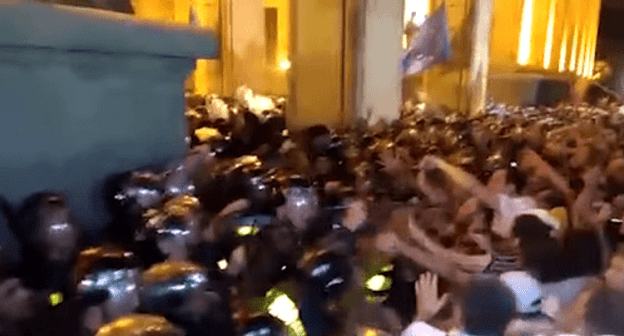 Clashes between protesters and policemen at the Parliament building in Georgia. Screenshot from video posted by 360 at https://www.youtube.com/watch?v=aZU3u6KCY8M Clashes between protesters and policemen at the Parliament building in Georgia. Screenshot from video posted by 360 at https://www.youtube.com/watch?v=aZU3u6KCY8M