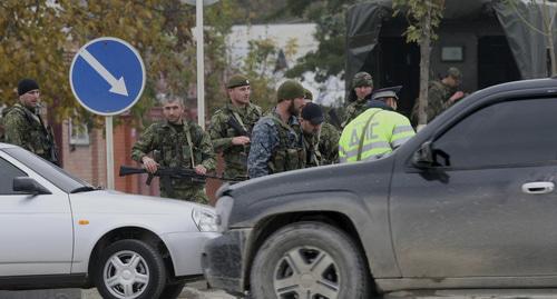 Law enforcers. Grozny. Photo: REUTERS/Alkhan Gargayev Law enforcers. Grozny. Photo: REUTERS/Alkhan Gargayev