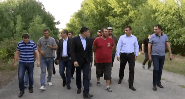 Released Georgian citizens return to the Georgian territory accompanied by law enforcers. Screenshot from video posted by the Ministry in Internal Affairs of Georgia Released Georgian citizens return to the Georgian territory accompanied by law enforcers. Screenshot from video posted by the Ministry in Internal Affairs of Georgia
