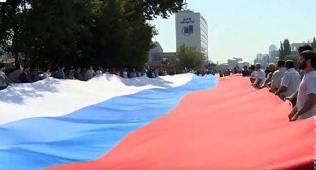 Celebration of the Day of the National Flag of Russia in Chechnya. Screenshot from video by 'Grozny' TV Company Celebration of the Day of the National Flag of Russia in Chechnya. Screenshot from video by 'Grozny' TV Company