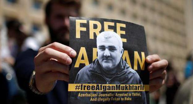 A poster with Afghan Mukhtarly's photo. Photo: REUTERS/David Mdzinarishvili A poster with Afghan Mukhtarly's photo. Photo: REUTERS/David Mdzinarishvili