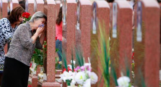 Grieving women at a cemetary in the town of Beslan on September 3, 2010. Photo: REUTERS / Kazbek Basaev Grieving women at a cemetary in the town of Beslan on September 3, 2010. Photo: REUTERS / Kazbek Basaev