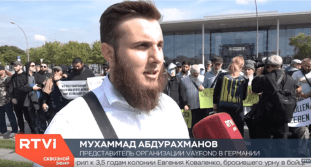 Mukhammad Abdurakhmanov at the rally in Berlin on September 4, 2019. Screenshot of the video https://www.youtube.com/watch?v=64zQFCuBo8Q Mukhammad Abdurakhmanov at the rally in Berlin on September 4, 2019. Screenshot of the video https://www.youtube.com/watch?v=64zQFCuBo8Q