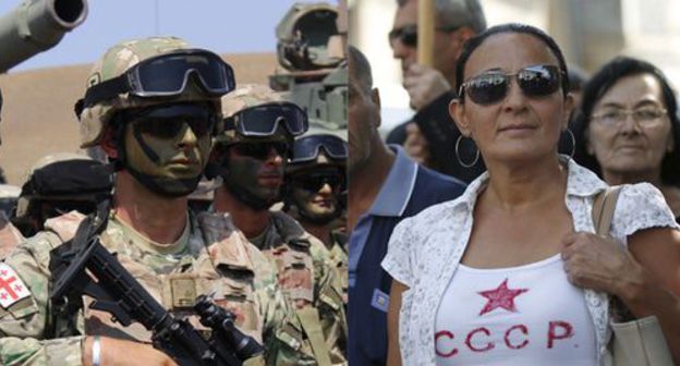 Noble Partner 2017 military exercises and a woman wearing a T-shirt with the inscription "USSR". Collage by the "Caucasian Knot". Photo: REUTERS/David Mdzinarishvili, Inna Kukudjanova for the "Caucasian Knot" Noble Partner 2017 military exercises and a woman wearing a T-shirt with the inscription "USSR". Collage by the "Caucasian Knot". Photo: REUTERS/David Mdzinarishvili, Inna Kukudjanova for the "Caucasian Knot"