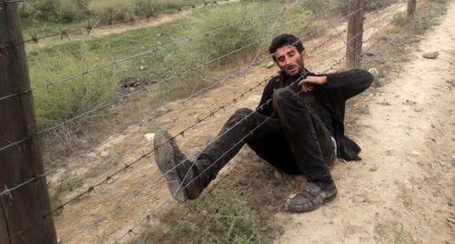 A man who tried to illegally cross a border with Iran. Photo by the press service of the State Border Guard Service of Azerbaijan http://dsx.gov.az/xeber/897 A man who tried to illegally cross a border with Iran. Photo by the press service of the State Border Guard Service of Azerbaijan http://dsx.gov.az/xeber/897