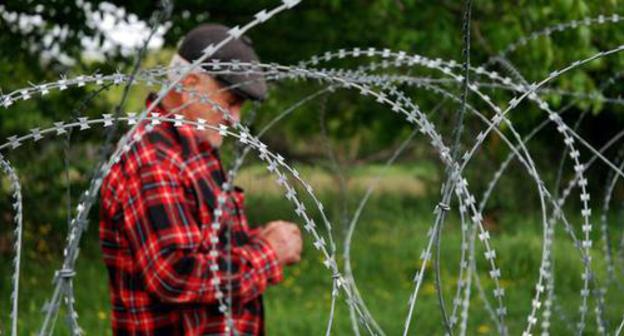 The border territory between South Ossetia and Georgia. Photo by Jelger Groeneveld - https://commons.wikimedia.org/wiki/Category:South_Ossetia?uselang=ru#/media/File:Georgian_farmer_at_Khurvaleti_victim_of_borderization_by_Russian_and_South_Ossetian_troops.jp The border territory between South Ossetia and Georgia. Photo by Jelger Groeneveld - https://commons.wikimedia.org/wiki/Category:South_Ossetia?uselang=ru#/media/File:Georgian_farmer_at_Khurvaleti_victim_of_borderization_by_Russian_and_South_Ossetian_troops.jp