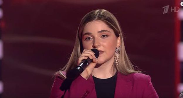 Ragda Khanieva. Screenshot of the video on YouTube Голос / The Voice Russia https://www.youtube.com/watch?v=B5BVyY6glCQ Ragda Khanieva. Screenshot of the video on YouTube Голос / The Voice Russia https://www.youtube.com/watch?v=B5BVyY6glCQ