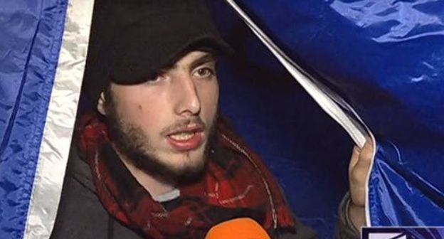 Activist in a tent at the parliament building. Screenshot from the "Rustavi-2" TV Channel video broadcasting, http://rustavi2.ge/ka/news/147624 Activist in a tent at the parliament building. Screenshot from the "Rustavi-2" TV Channel video broadcasting, http://rustavi2.ge/ka/news/147624