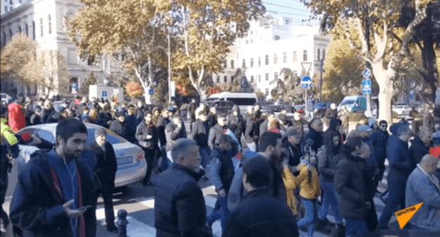 A rally near the National Library in Tbilisi on November 29, 2019. Screenshot of the video by Sputnik Georgia https://sputnik-georgia.ru/video/20191129/247144476/Oppozitsiya-v-ocherednoy-raz-popytalas-pomeshat-rabote-parlamenta-Gruzii-video.html A rally near the National Library in Tbilisi on November 29, 2019. Screenshot of the video by Sputnik Georgia https://sputnik-georgia.ru/video/20191129/247144476/Oppozitsiya-v-ocherednoy-raz-popytalas-pomeshat-rabote-parlamenta-Gruzii-video.html