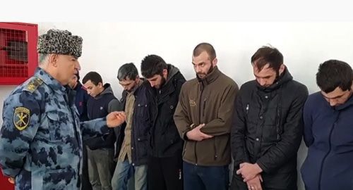 The Minister of the Internal Affairs reproaches the men detained on suspicion of drinking alcoholic beverages and using psychotropic substances, Gudermes District of Chechnya. Photo: official account of Chechen MIA, http://www.instagram.com/p/B5k3-STFR-y/ The Minister of the Internal Affairs reproaches the men detained on suspicion of drinking alcoholic beverages and using psychotropic substances, Gudermes District of Chechnya. Photo: official account of Chechen MIA, http://www.instagram.com/p/B5k3-STFR-y/