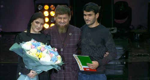 Suleimanov brother and sister receive keys from a new apartmeny in Grozny. Photo by the press service of the Akhmat Kadyrov Fund Suleimanov brother and sister receive keys from a new apartmeny in Grozny. Photo by the press service of the Akhmat Kadyrov Fund