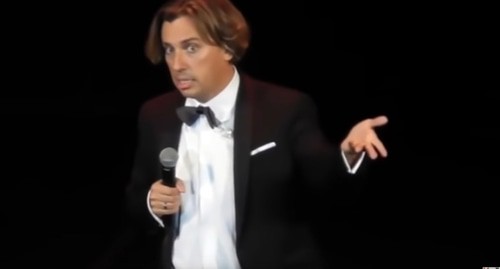 Maxim Galkin during the performance. Screenshot of the video by InformDetox https://www.youtube.com/watch?v=7oKtEYVfSRk&feature=emb_logo Maxim Galkin during the performance. Screenshot of the video by InformDetox https://www.youtube.com/watch?v=7oKtEYVfSRk&feature=emb_logo