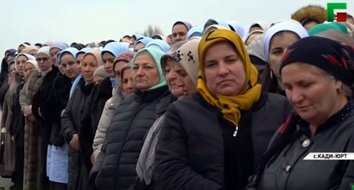 Participants of the ceremony held after the construction of new houses in Kadi-Yurt on December 24, 2019. Screenshot of the video by the "Grozny" TV channel https://www.youtube.com/watch?v=PjDss8DtPFk&feature=emb_logo Participants of the ceremony held after the construction of new houses in Kadi-Yurt on December 24, 2019. Screenshot of the video by the "Grozny" TV channel https://www.youtube.com/watch?v=PjDss8DtPFk&feature=emb_logo