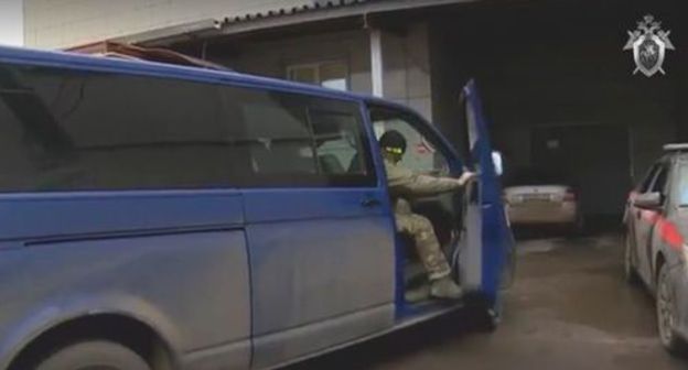 A car of the law enforcement agencies. Screenshot from video made by the Investigative Committee of the Russian Federation: https://yandex.ru/search/? A car of the law enforcement agencies. Screenshot from video made by the Investigative Committee of the Russian Federation: https://yandex.ru/search/?