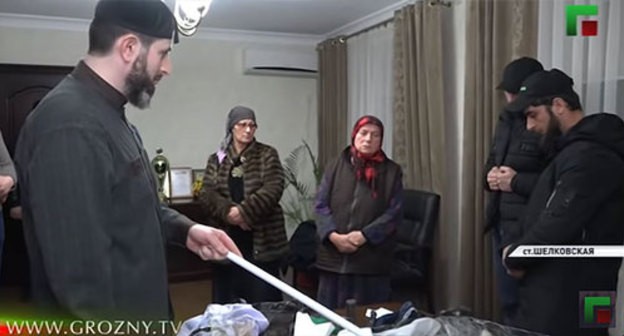 Adam Elzhurkaev talks to the detained women and their sons. Screenshot of the video by the Grozny TV Channel https://www.youtube.com/watch?v=ziKQdQCjkqA" Adam Elzhurkaev talks to the detained women and their sons. Screenshot of the video by the Grozny TV Channel https://www.youtube.com/watch?v=ziKQdQCjkqA"