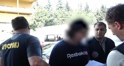 The detention of Mikhail Kalandiya. Screenshot of the video posted at the YouTube პირველი არხი Georgian Public Broadcaster https://www.youtube.com/watch?v=nmvggRz3Q-Q&feature=emb_logo The detention of Mikhail Kalandiya. Screenshot of the video posted at the YouTube პირველი არხი Georgian Public Broadcaster https://www.youtube.com/watch?v=nmvggRz3Q-Q&feature=emb_logo