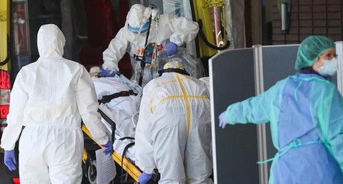 Health workers in protective clothing. Photo: REUTERS/Susana Vera Health workers in protective clothing. Photo: REUTERS/Susana Vera