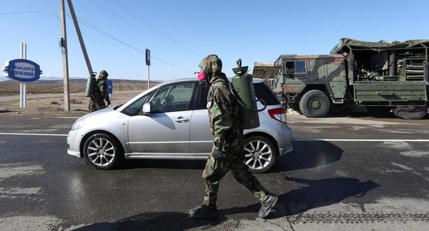 A cleaning services specialist disinfects streets in the village of Marabda. March 23, 2020. Photo: REUTERS/Irakli Gedenidze A cleaning services specialist disinfects streets in the village of Marabda. March 23, 2020. Photo: REUTERS/Irakli Gedenidze