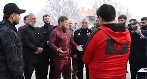 Aslambek Akhmetkhanov (in red) standing in front of Ramzan Kadyrov. Screenshot of the video by the Grozny TV channel "The head of Chechnya harshly reprimanded Aslambek Akhmetkhanov" https://youtu.be/IUHeFy2cpfk Aslambek Akhmetkhanov (in red) standing in front of Ramzan Kadyrov. Screenshot of the video by the Grozny TV channel "The head of Chechnya harshly reprimanded Aslambek Akhmetkhanov" https://youtu.be/IUHeFy2cpfk