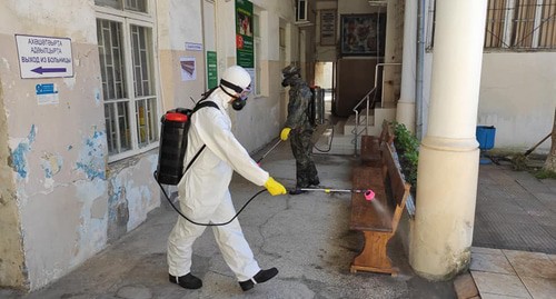 Worker in a protective suit is conducting disinfection, Abkhazia. Photo: press service of the Ministry for Emergencies of Abkhazia Worker in a protective suit is conducting disinfection, Abkhazia. Photo: press service of the Ministry for Emergencies of Abkhazia