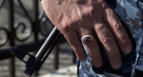 A hand of a law enforcer. Photo: REUTERS/Maxim Shemetov A hand of a law enforcer. Photo: REUTERS/Maxim Shemetov