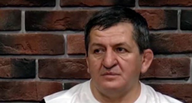Abdulmanap Nurmagomedov. Screenshot of the video by "Vremya Sporta" https://www.youtube.com/watch?v=HWyclHTd89o Abdulmanap Nurmagomedov. Screenshot of the video by "Vremya Sporta" https://www.youtube.com/watch?v=HWyclHTd89o