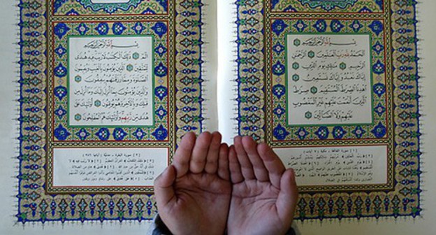 A child's hands and the Quran. Photo: REUTERS/Ali Jarekji AJ/THI A child's hands and the Quran. Photo: REUTERS/Ali Jarekji AJ/THI