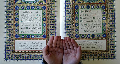 A child's hands and the Quran. Photo: REUTERS/Ali Jarekji AJ/THI A child's hands and the Quran. Photo: REUTERS/Ali Jarekji AJ/THI