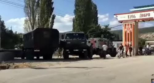 Law enforcers near the Gubden village in Dagestan. Screenshot of the video by Ruslan Kurbanov "СРОЧНО: Военные в Дагестане введены в село с техникой" https://www.youtube.com/watch?v=-fhzcXBLrWc&feature=emb_logo Law enforcers near the Gubden village in Dagestan. Screenshot of the video by Ruslan Kurbanov "СРОЧНО: Военные в Дагестане введены в село с техникой" https://www.youtube.com/watch?v=-fhzcXBLrWc&feature=emb_logo