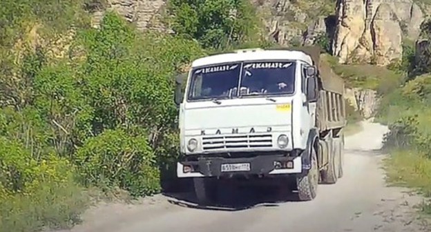 A truck in the Talghi canyon. Screenshot of a video https://www.youtube.com/watch?time_continue=65&v=QpkLKtVpS5E&feature=emb_logo A truck in the Talghi canyon. Screenshot of a video https://www.youtube.com/watch?time_continue=65&v=QpkLKtVpS5E&feature=emb_logo