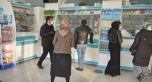 People in a pharmacy in Grozny. Photo: REUTERS/Ramzan Musaev. People in a pharmacy in Grozny. Photo: REUTERS/Ramzan Musaev.