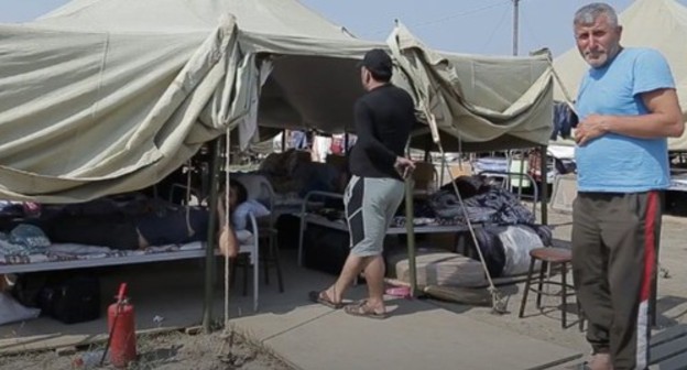 Residents of the camp in Kullar. Screenshot from the video posted by the Caucasian Knot at: https://www.youtube.com/watch?time_continue=110&v=11hN-YEmPIg&feature=emb_logo Residents of the camp in Kullar. Screenshot from the video posted by the Caucasian Knot at: https://www.youtube.com/watch?time_continue=110&v=11hN-YEmPIg&feature=emb_logo