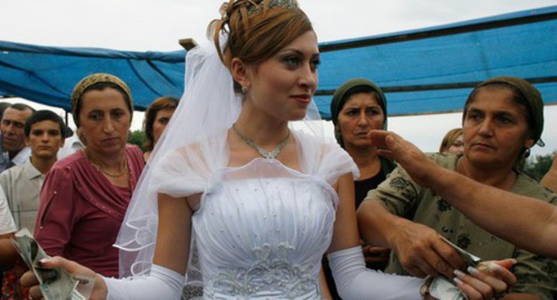 A wedding in the Caucasus. Photo: Reuters /Thomas Peter (RUSSIA) A wedding in the Caucasus. Photo: Reuters /Thomas Peter (RUSSIA)