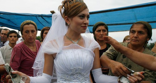 A wedding in the Caucasus. Photo: Reuters /Thomas Peter (RUSSIA) A wedding in the Caucasus. Photo: Reuters /Thomas Peter (RUSSIA)