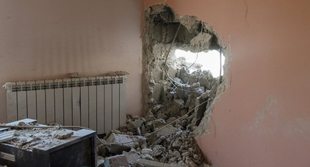 Hole in a wall from shelling attack of Azerbaijan. Photo: © Facebook / Արցախ / Տեղեկատվական շտաբ Hole in a wall from shelling attack of Azerbaijan. Photo: © Facebook / Արցախ / Տեղեկատվական շտաբ