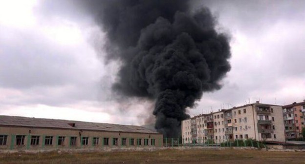 A smoke cloud rising above the building in Stepanakert, October 4, 2020. A screen capture from the video by the "Bars" documentary film studio A smoke cloud rising above the building in Stepanakert, October 4, 2020. A screen capture from the video by the "Bars" documentary film studio