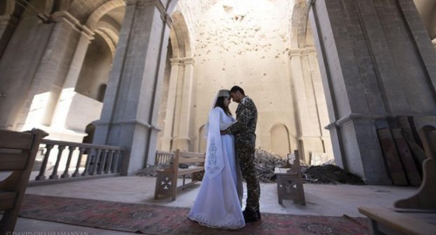 The wedding ceremony of Mariam Sargsyan, a resident of Martuni, and Ovik Ovsepyan, a volunteer of the Defence Army, in the partially destroyed Kazanchetsots Cathedral in the city of Shushi. October 24, 2020. Photo by David Gakhramanyan. Karabakh Information Centre, https://www.facebook.com/ArtsakhInformation/photos/a.104748431165946/200467334927388/?__tn__=%2CO*F The wedding ceremony of Mariam Sargsyan, a resident of Martuni, and Ovik Ovsepyan, a volunteer of the Defence Army, in the partially destroyed Kazanchetsots Cathedral in the city of Shushi. October 24, 2020. Photo by David Gakhramanyan. Karabakh Information Centre, https://www.facebook.com/ArtsakhInformation/photos/a.104748431165946/200467334927388/?__tn__=%2CO*F